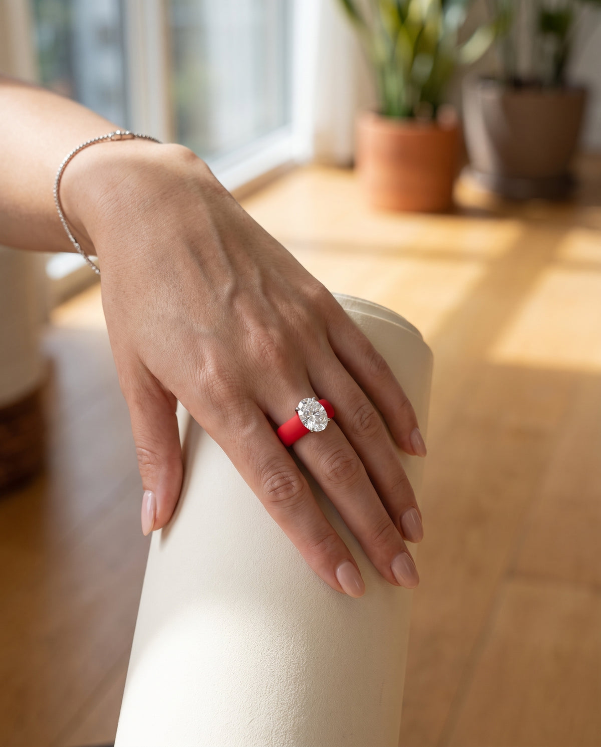 SABINA Flex Ring in Pompeii Red, worn in a yoga studio